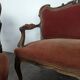 Louis XV style salon in carved walnut with orange velvet, seven pieces.