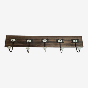 Wooden coat rack with porcelain numbers