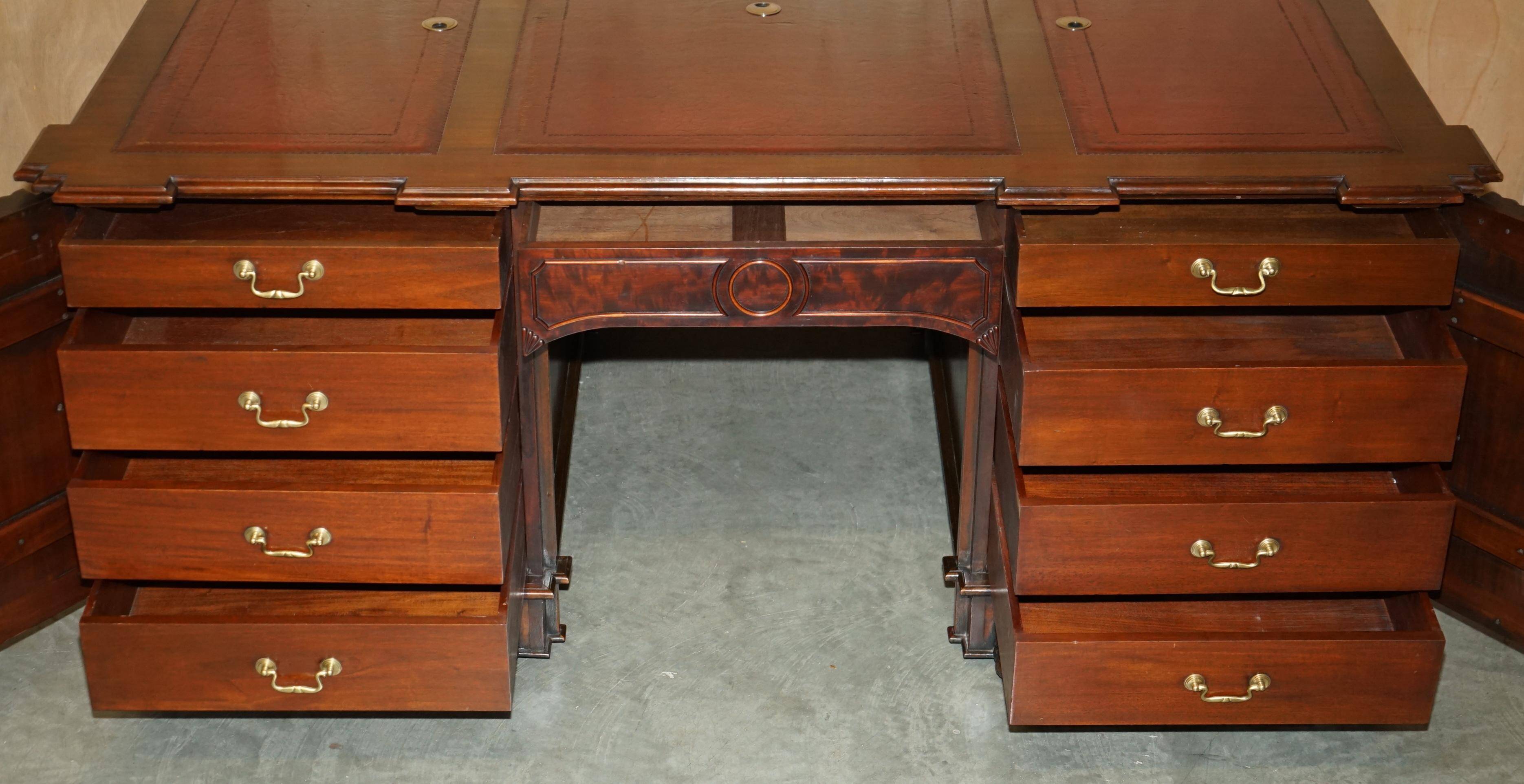 Partner desk with two carved columns featuring lion heads, according to Thomas Chippendale, restored.