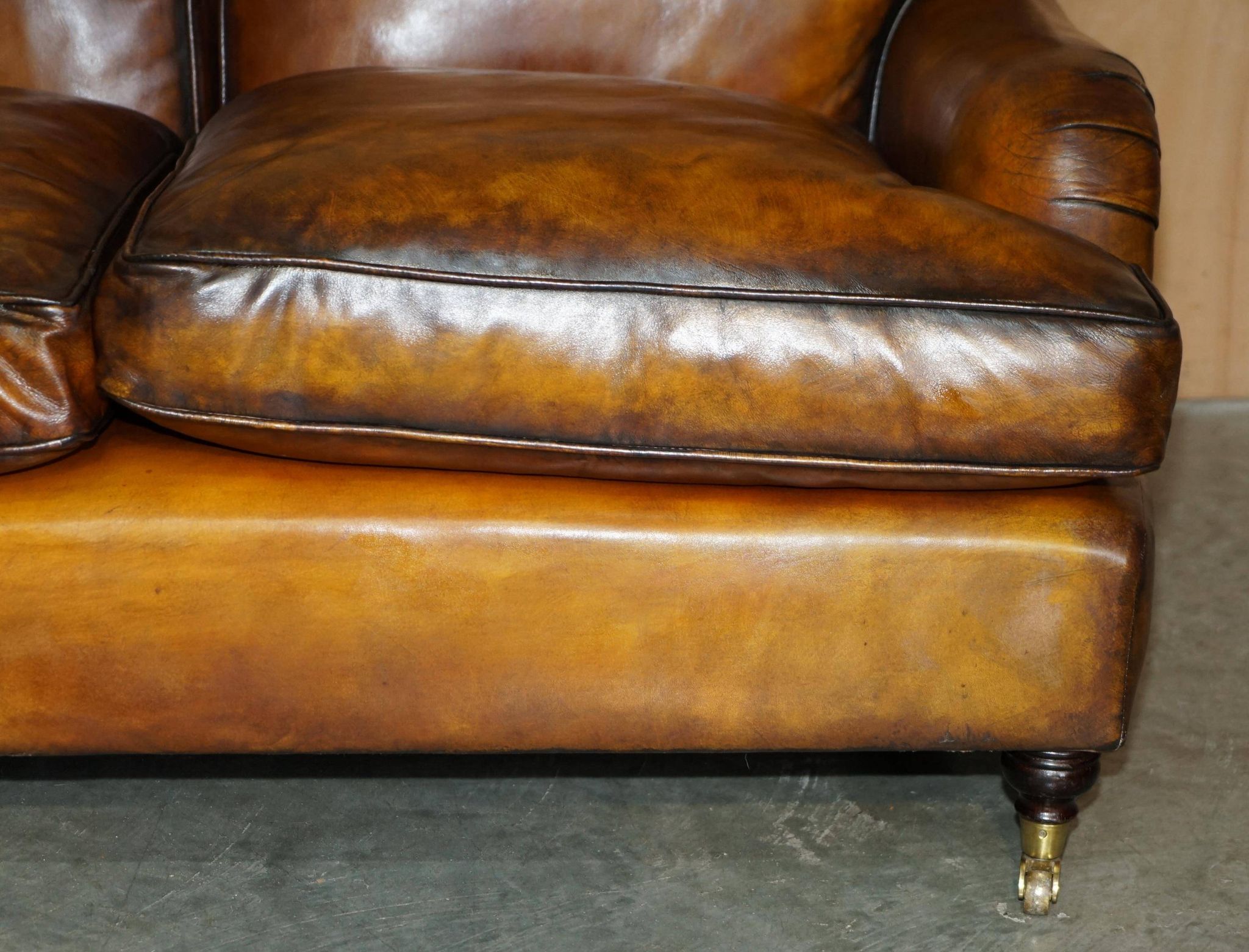 Howard & Son restored leather canapé, width 145 cm