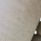 Vintage beige two-seater canapé with fringes.