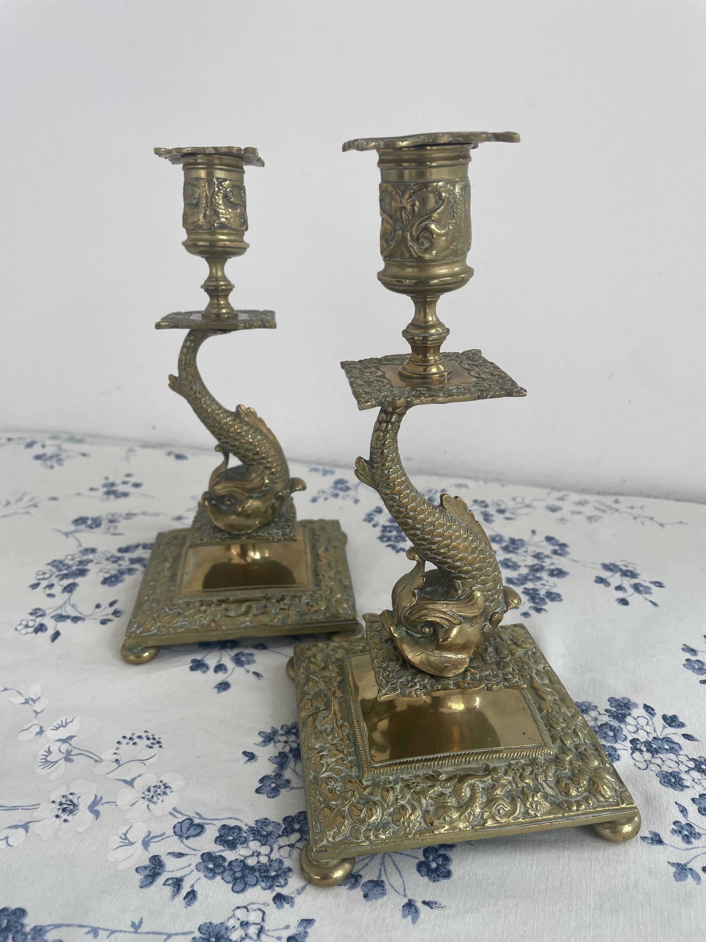 Pair of brass dolphin candlesticks, late 19th century, Napoleonic period