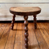 Low vintage wooden tripod stool