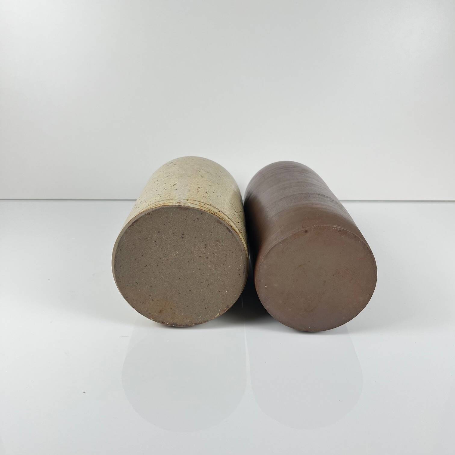 Duo of speckled stoneware and burgundy bottles, 20th century