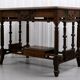19th-century carved walnut desk with a leather top.
