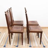 Set of 4 Louis XVI style chairs in carved wood and embossed leather.