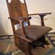 Antique Gothic Revival carved oak armchair, 1910