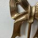 Solid brass bow and ribbon wall candle holder