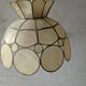 Suspension in mother-of-pearl and brass flower shape