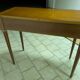 Extendable console table in cherry wood.