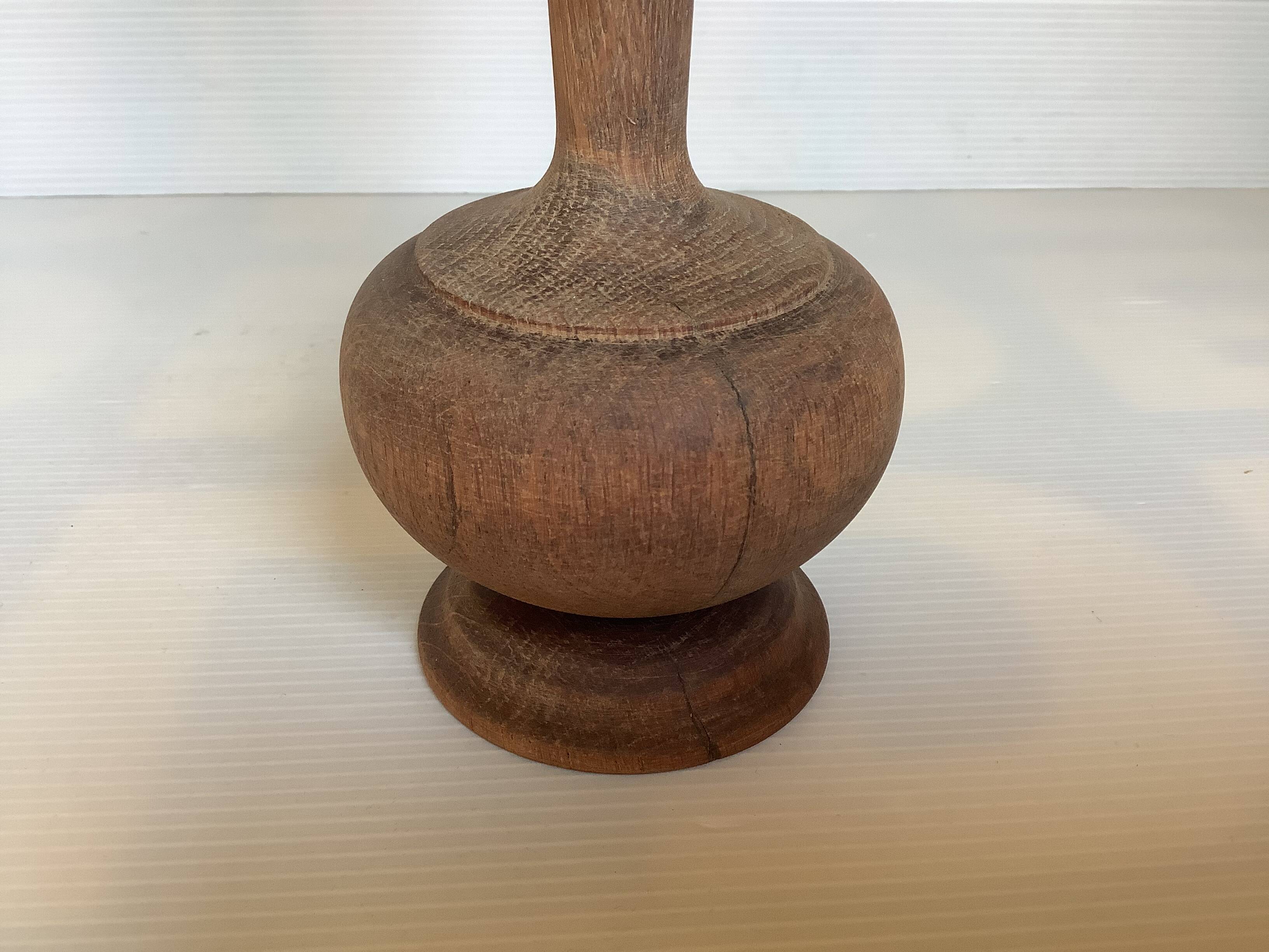 Old trumpet-shaped wooden vase