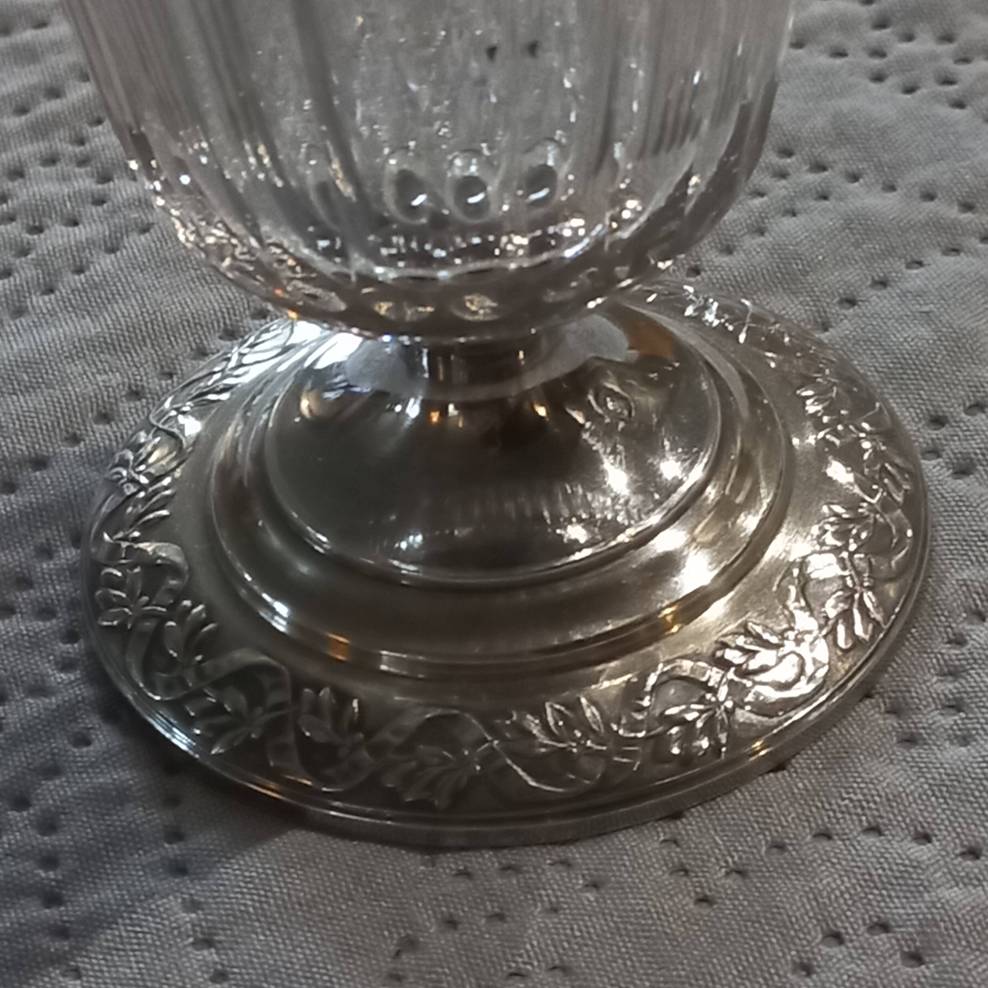 Crystal and solid silver shaker, neck brace and master's mark.