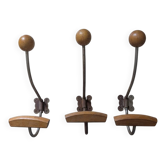 Three vintage coat hooks
