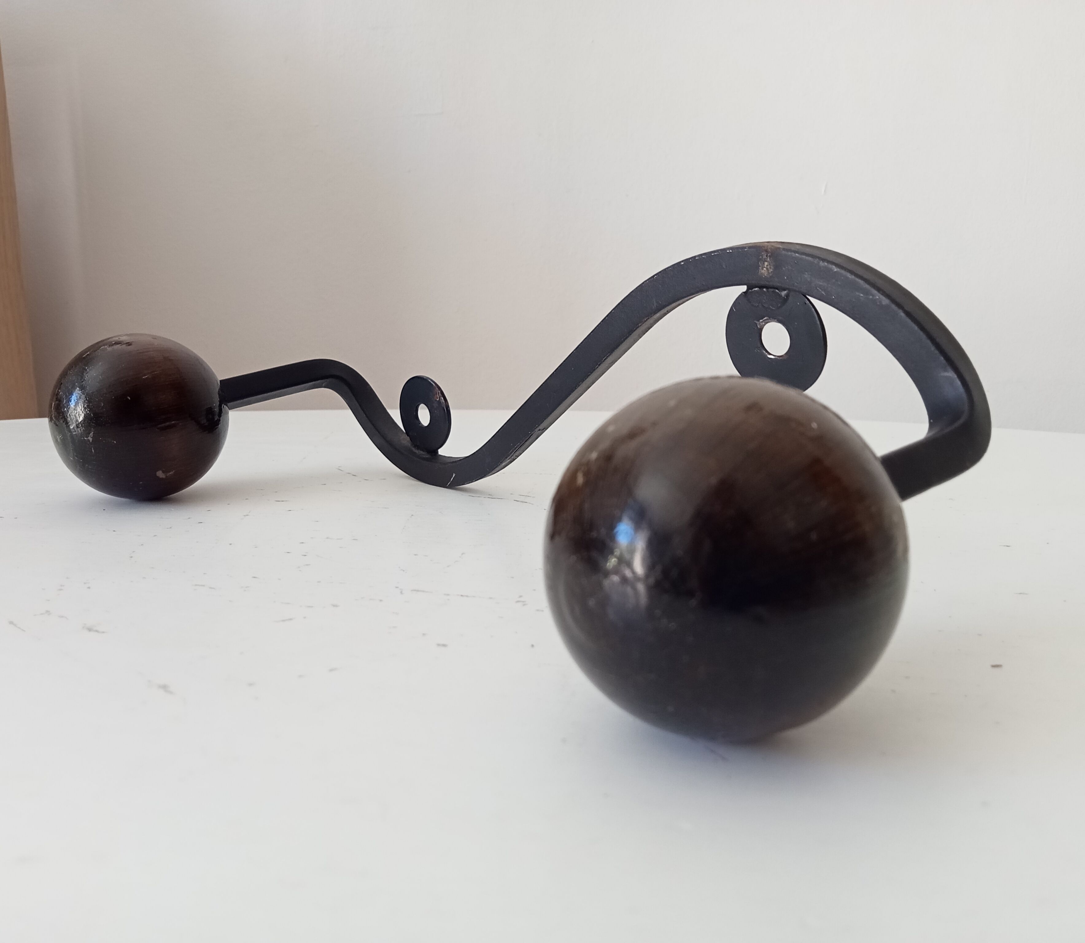 Wood and wrought iron ball coat rack from the 1950s.