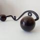Wood and wrought iron ball coat rack from the 1950s.