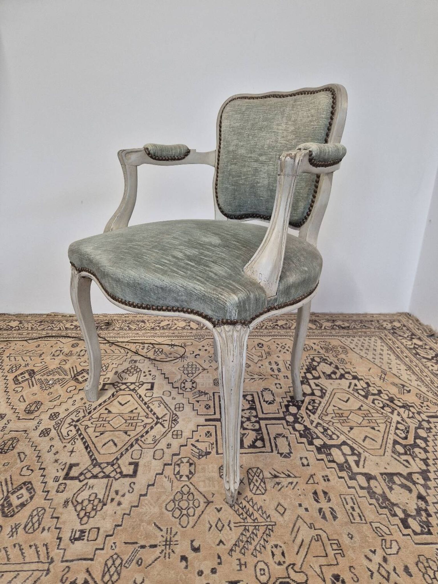 Louis XV style cabriolet armchair in patinated wood and velvet