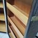 Wardrobe trunk on casters in mahogany and woven rattan.
