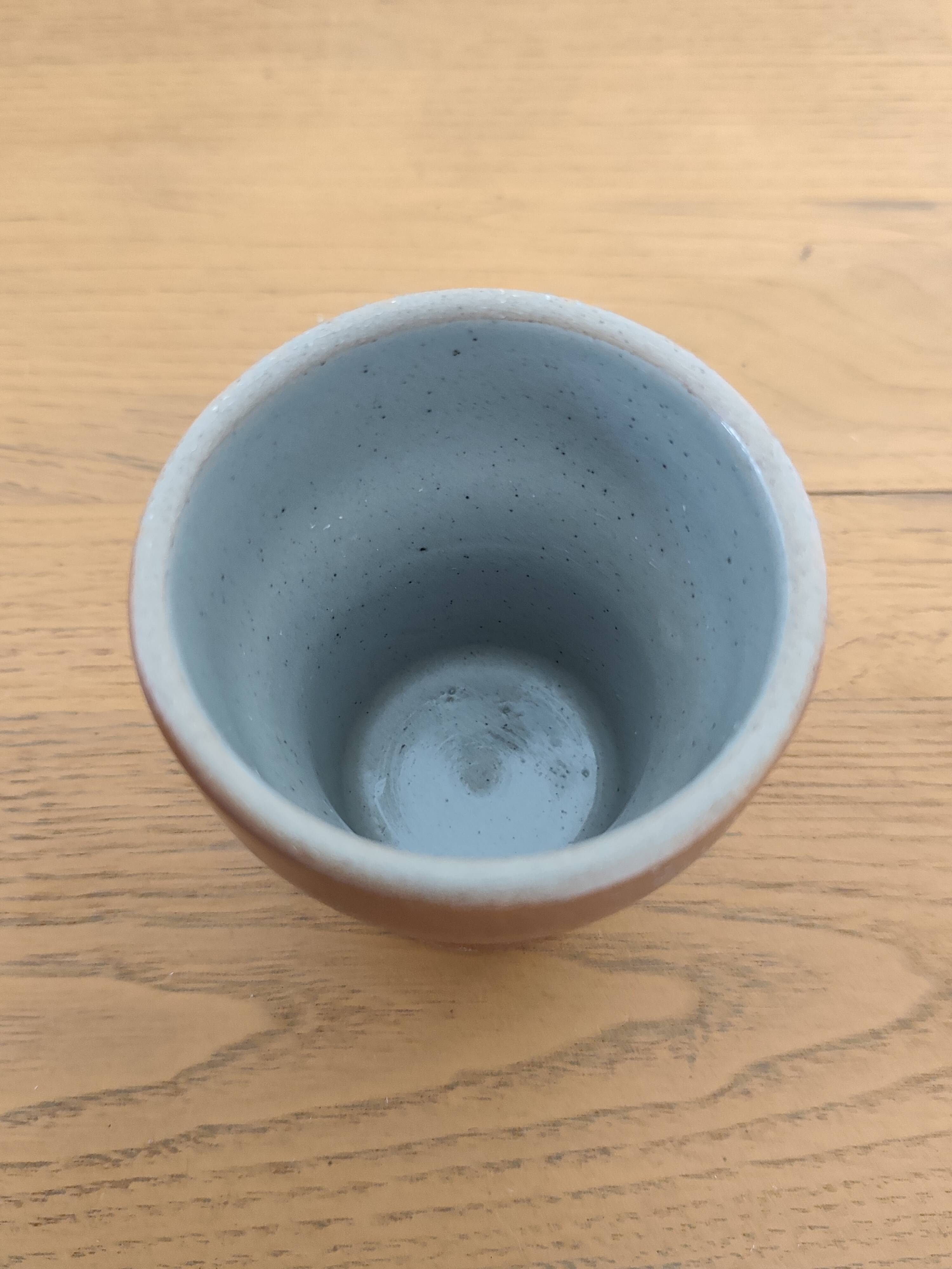 Stoneware cups – Armor stoneware set of 10 and an 11th French stoneware cup.