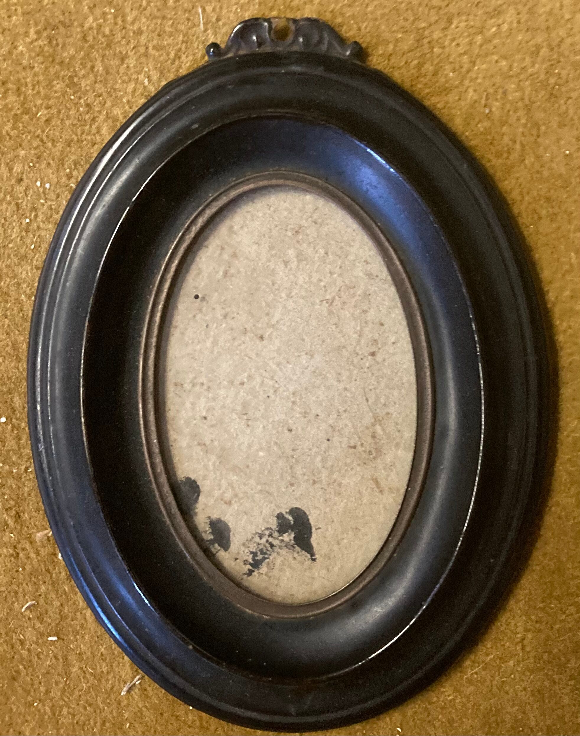 Blackened brass Nap III frame.