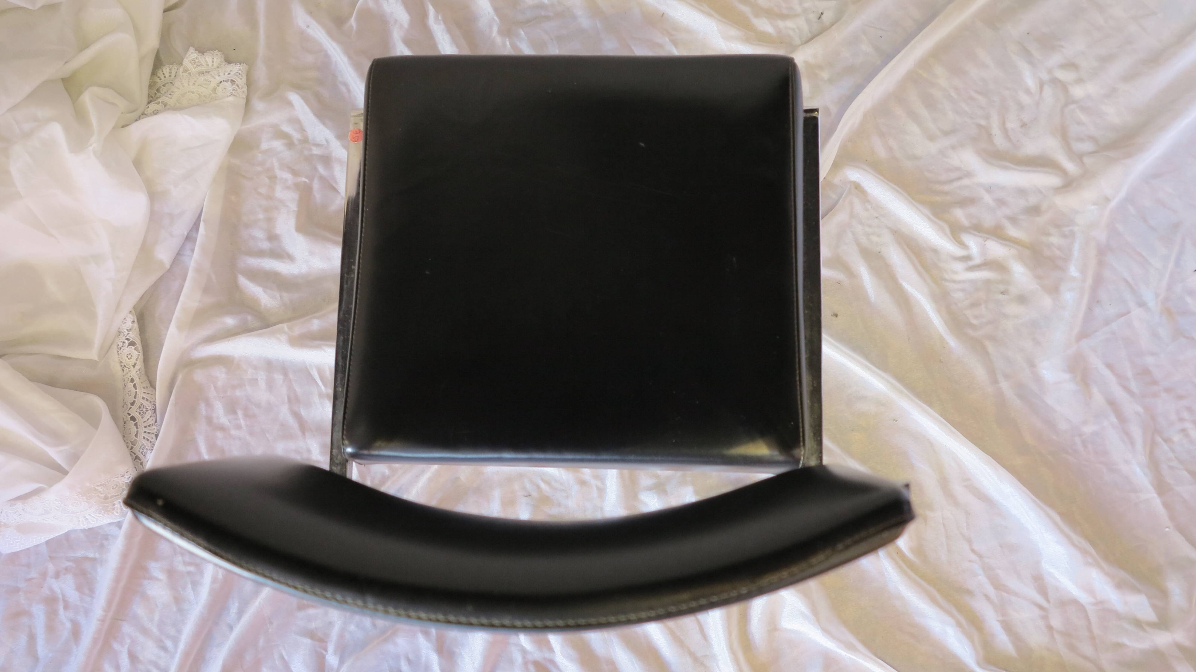 Modernist chair in chromed metal and black imitation leather