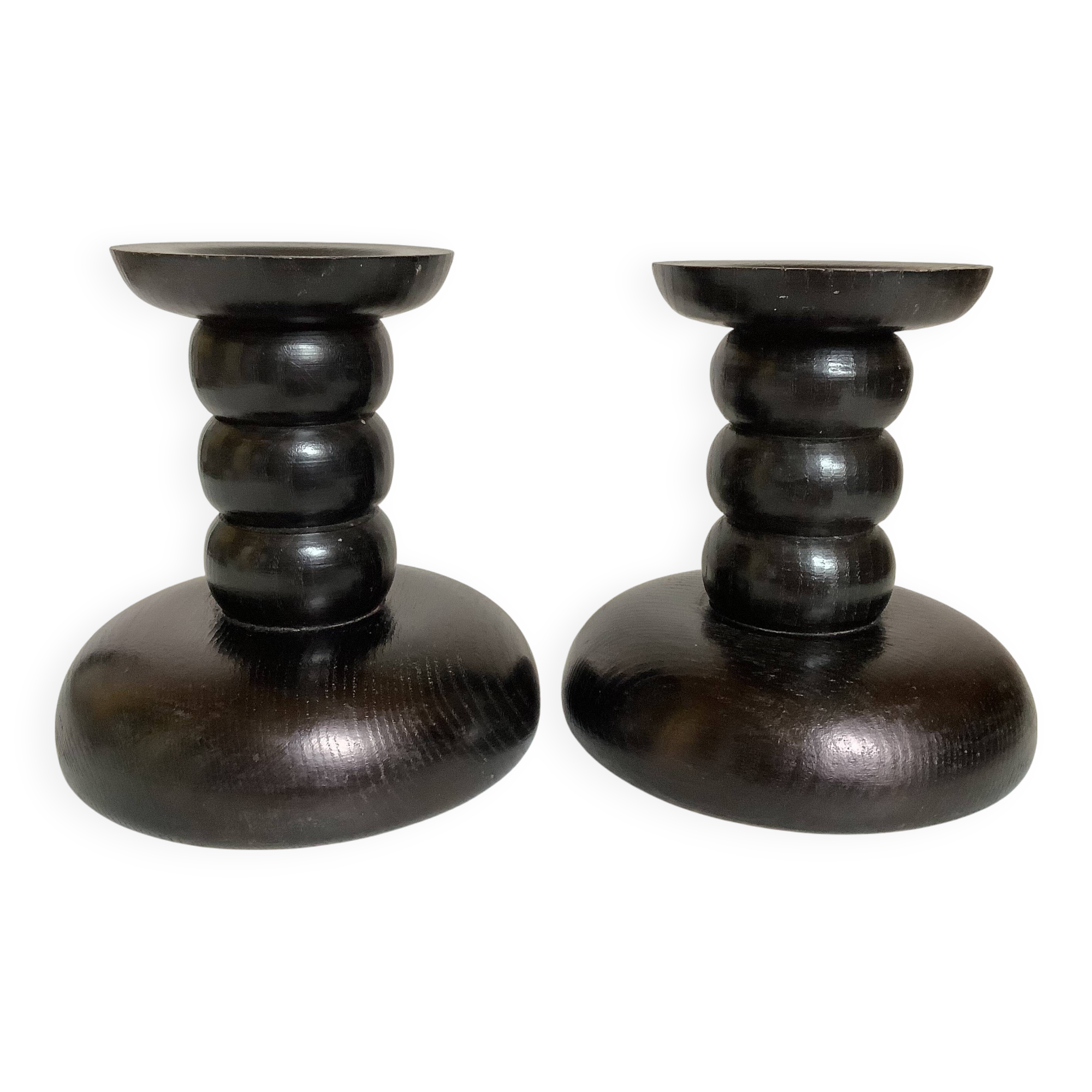 Pair of black stained wooden candlesticks