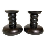 Pair of black stained wooden candlesticks