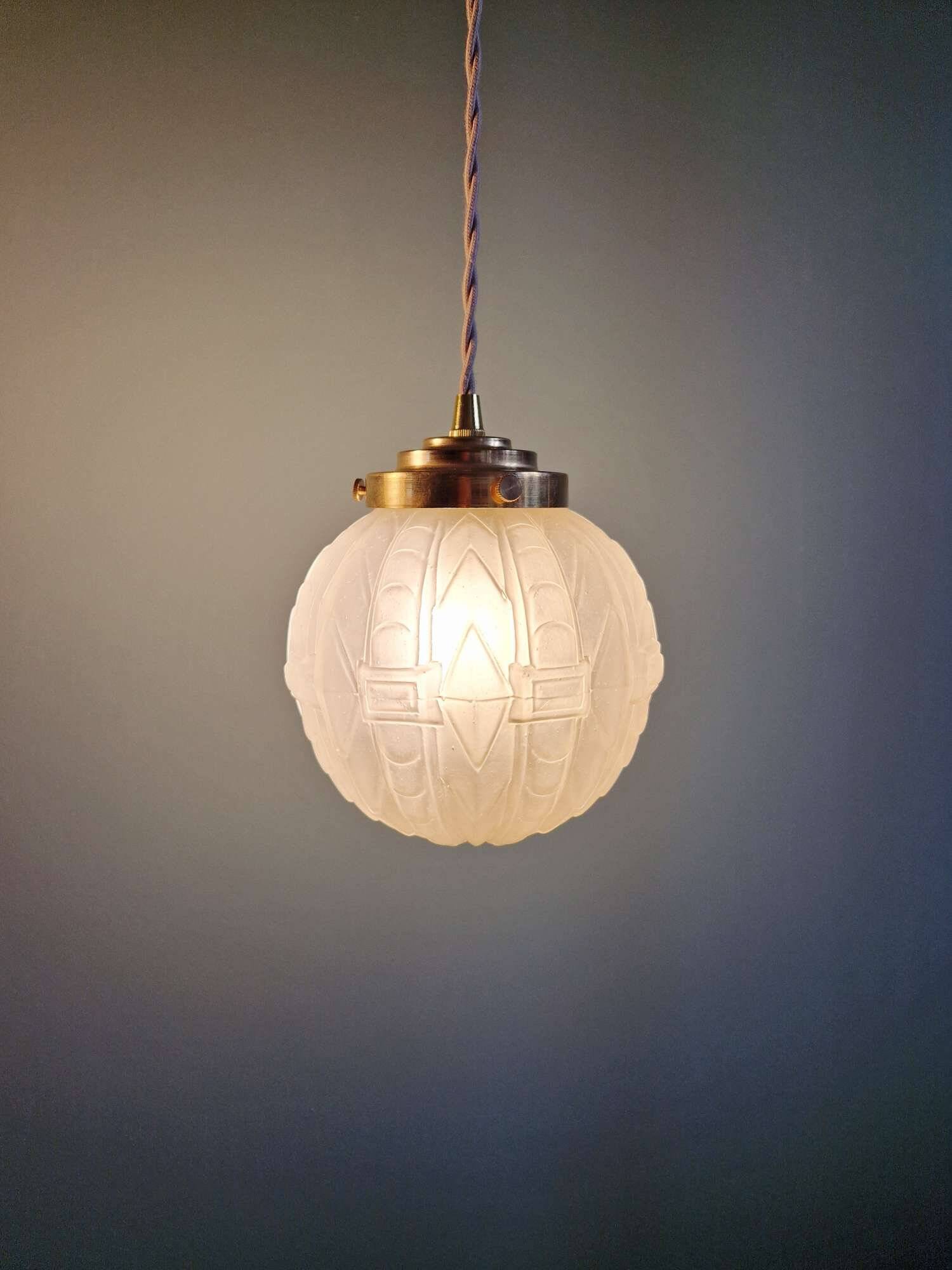 Pair of Art Deco pendant lights in pressed molded satin glass, 1920-30