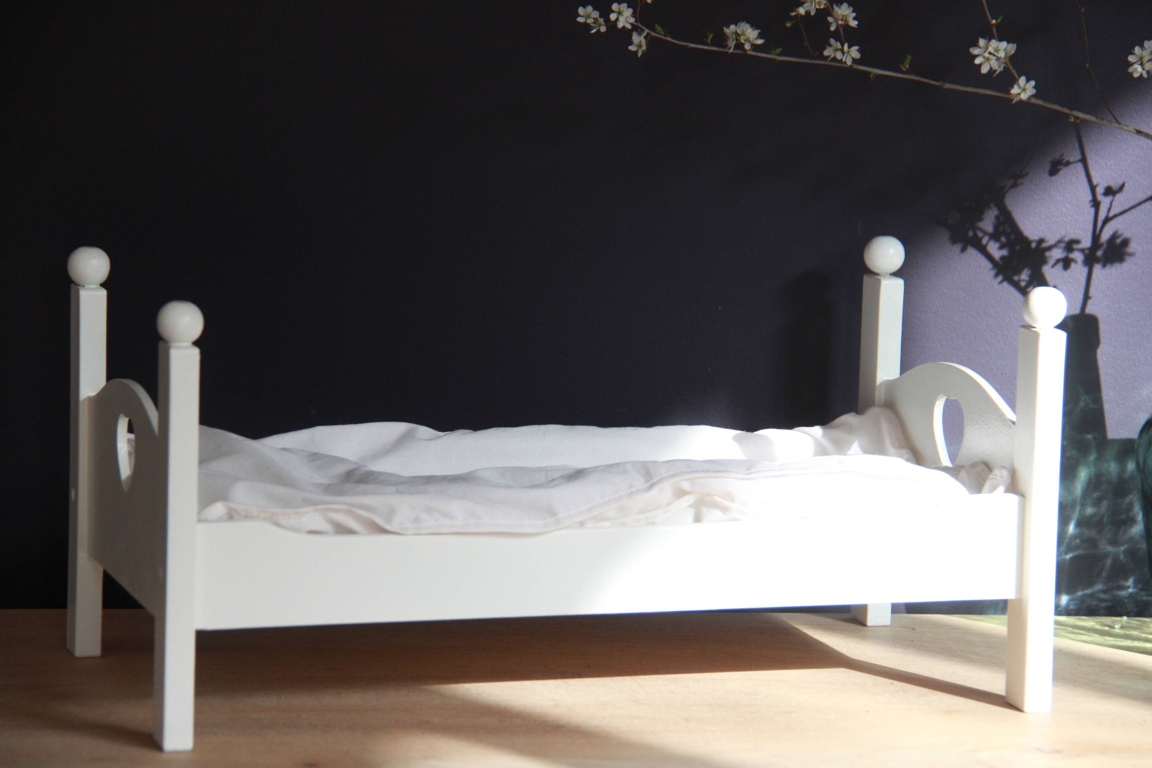 Painted wooden doll bed