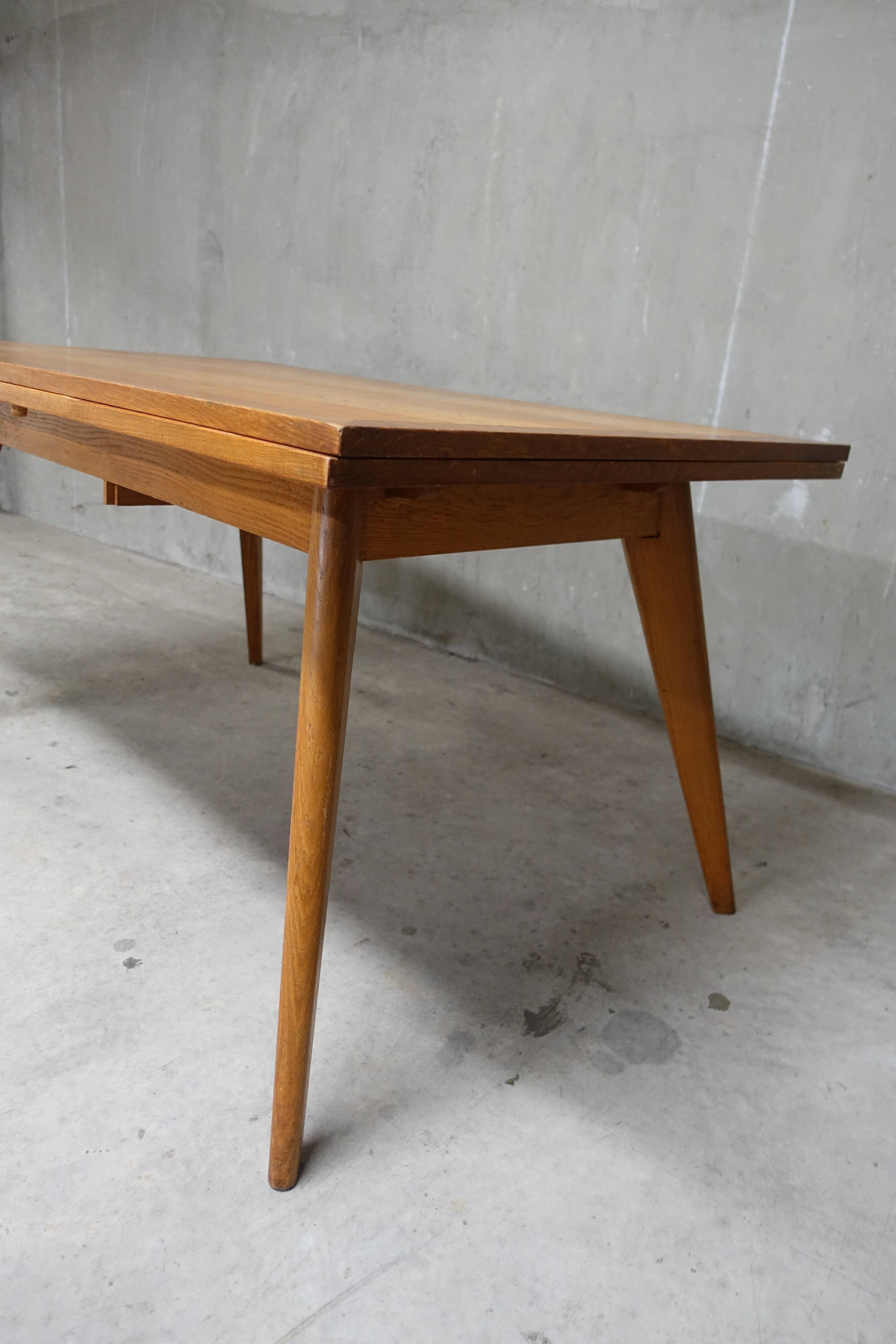 Dining table in blond oak compass feet 1950