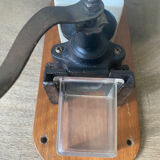 Old wall-mounted coffee grinder