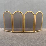 Antique brass fireplace screen from 1920, vintage spark guard.