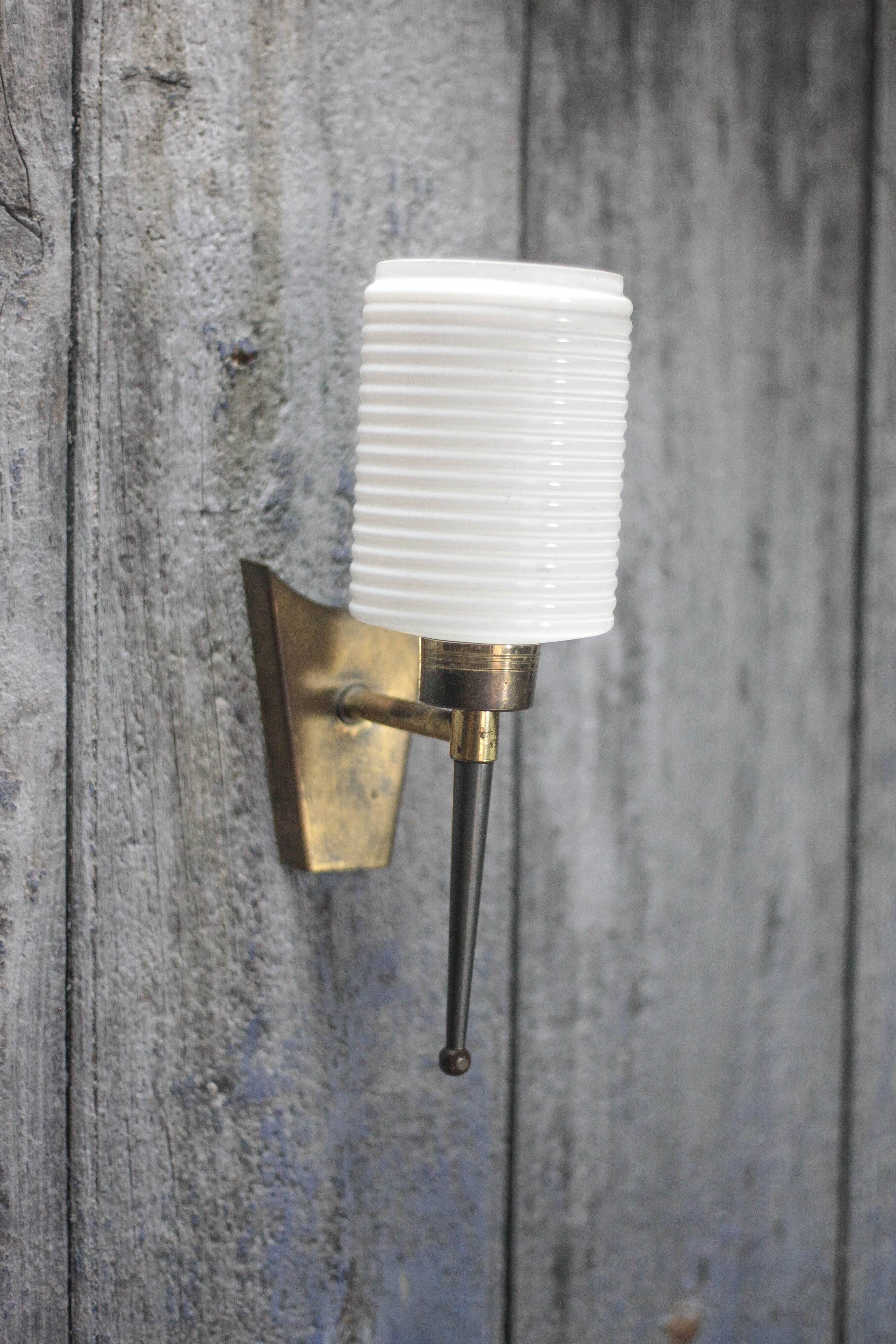 Brass wall light, black lacquered metal and white opal glass, 50s.