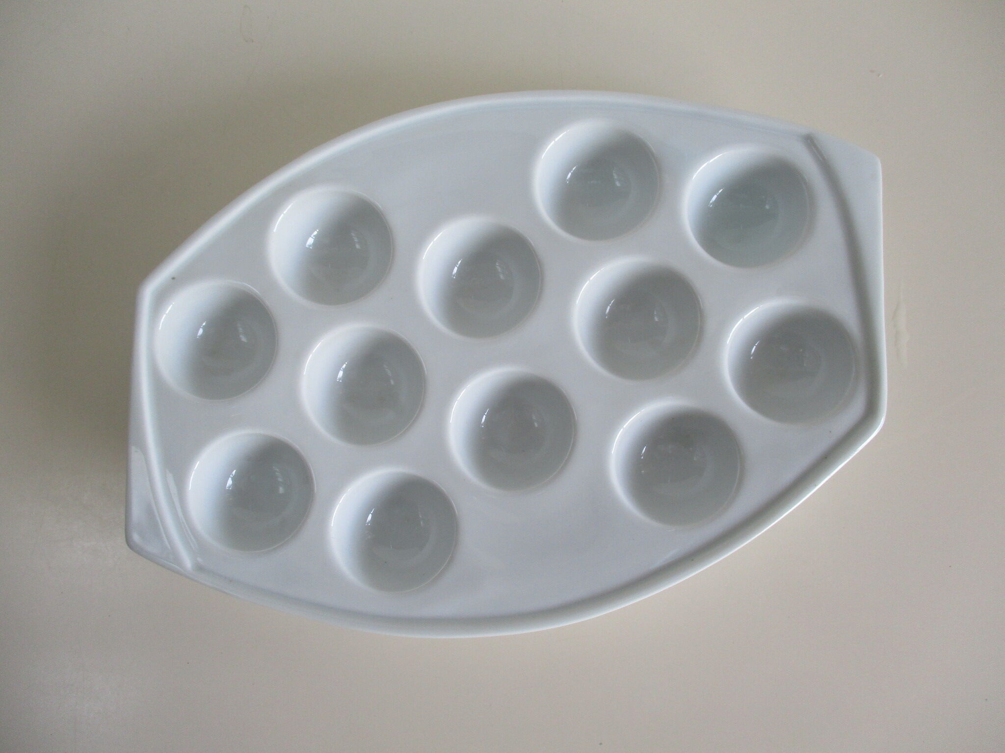 White porcelain snail dish