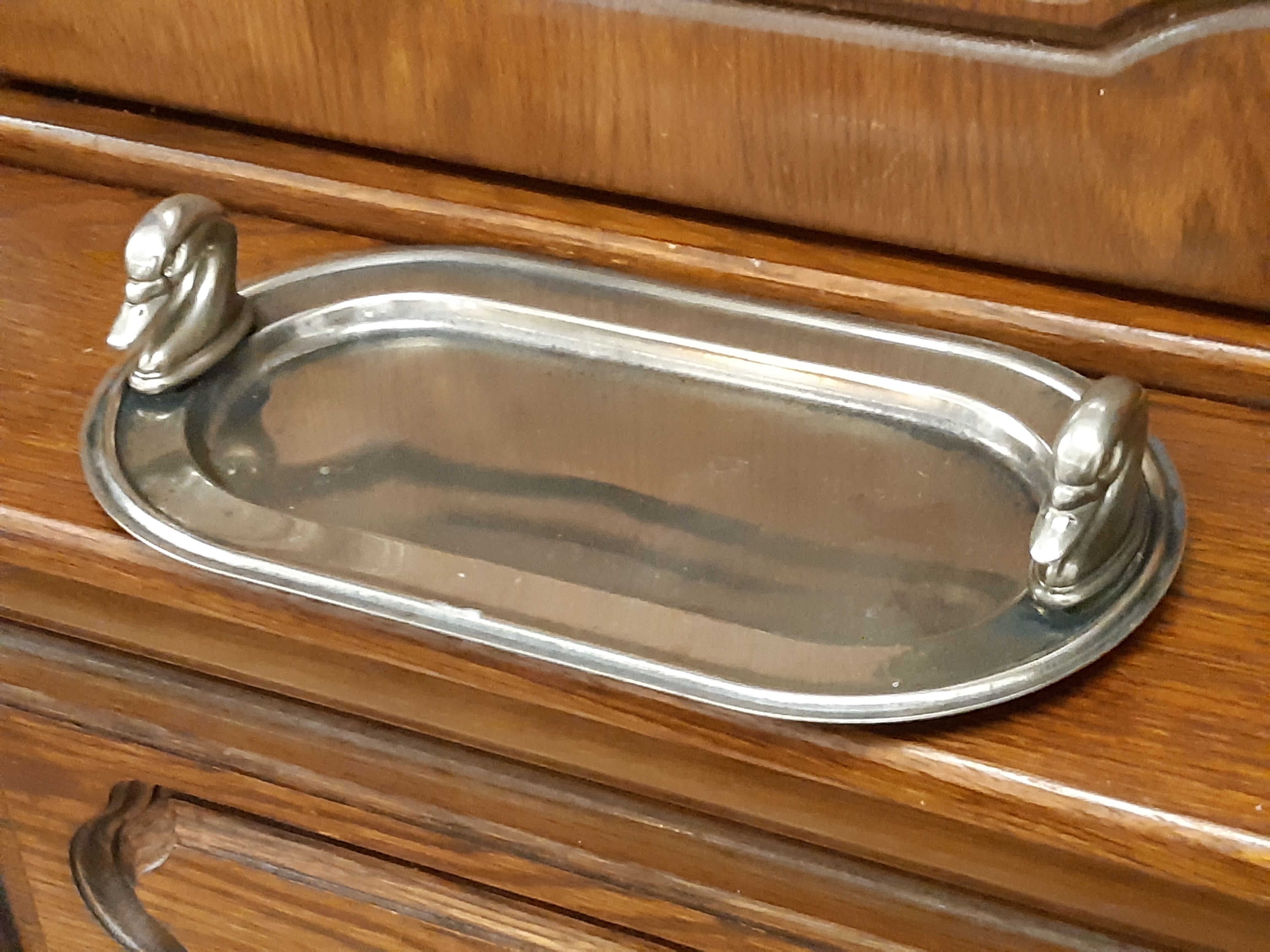 Silver dish with foie gras, duck heads