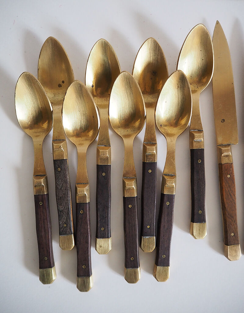 Set of old dessert cutlery in wood and brass