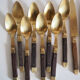 Set of old dessert cutlery in wood and brass