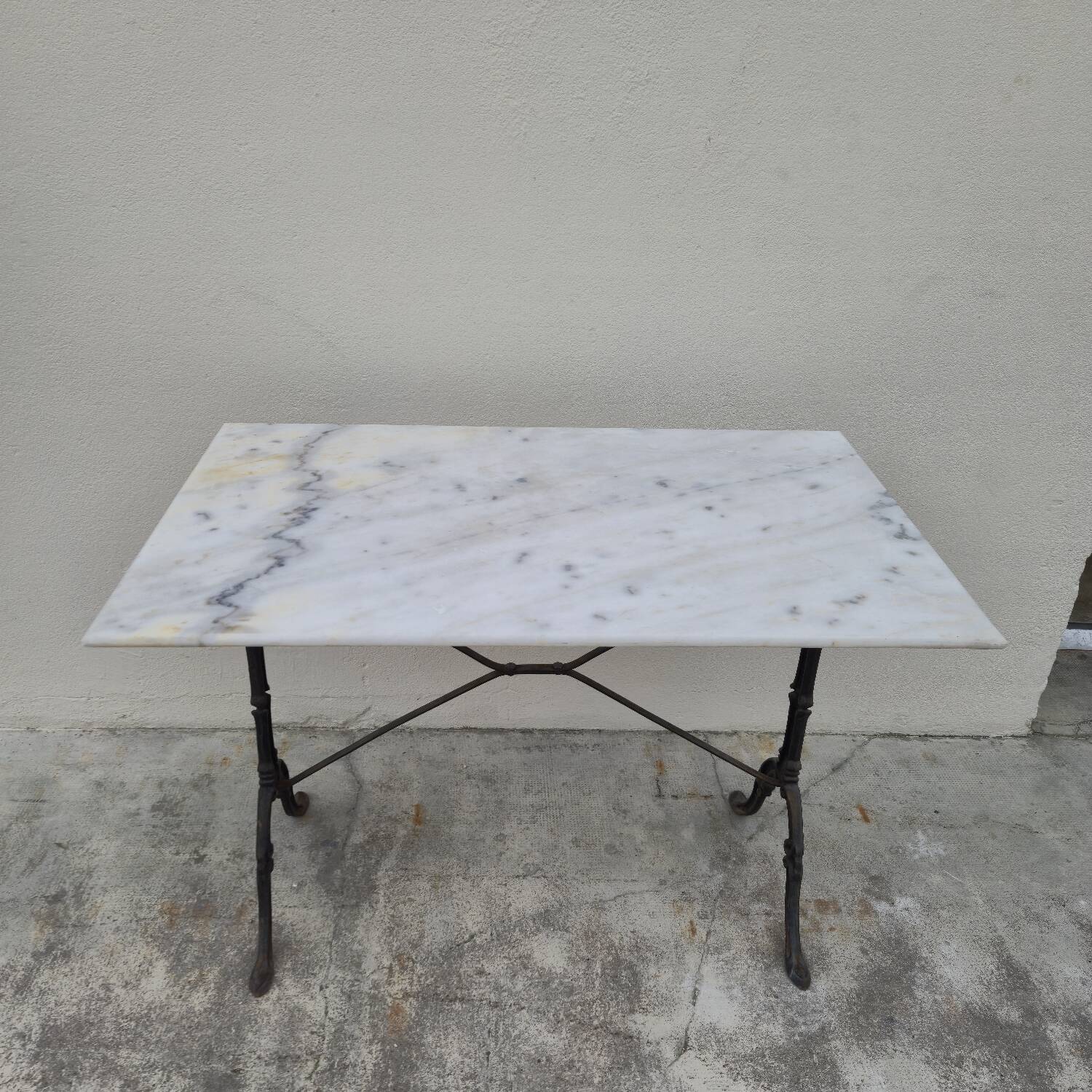 Antique cast iron and marble bistro restaurant table