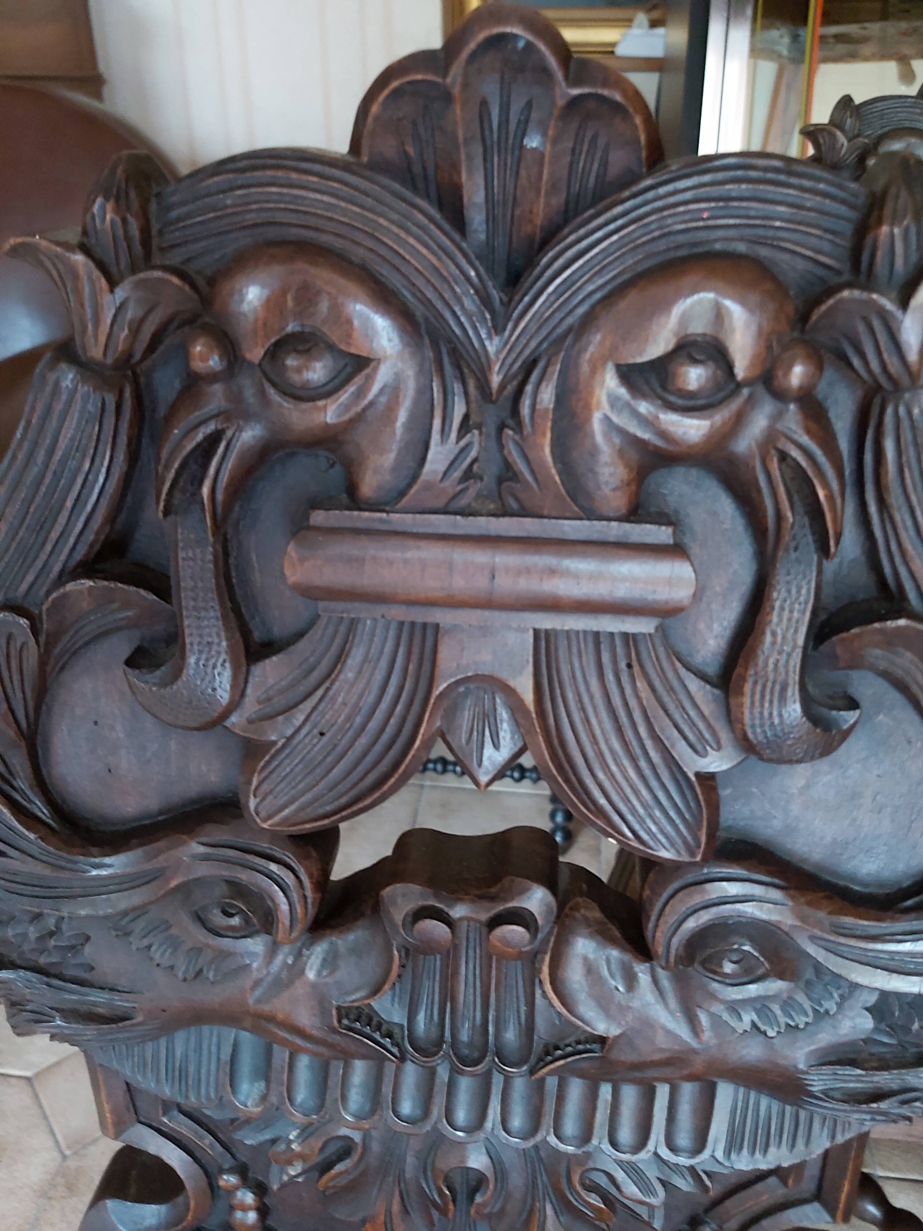 4 stylized dolphin back chairs