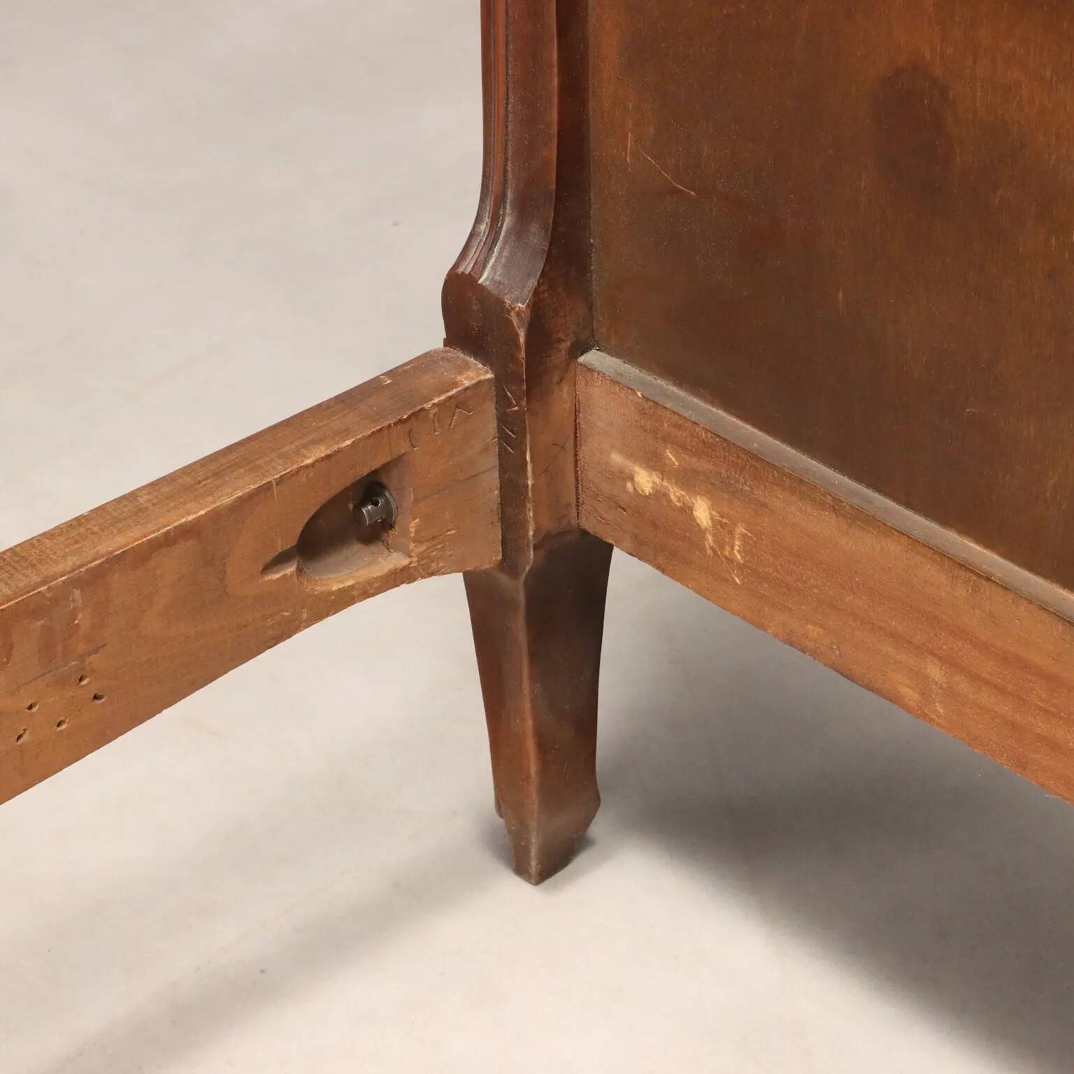 Simple bed in Barocchetto style in walnut.