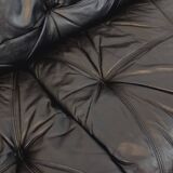 Vintage corner sofa composed of 3 modules in black leather with integrated bed.