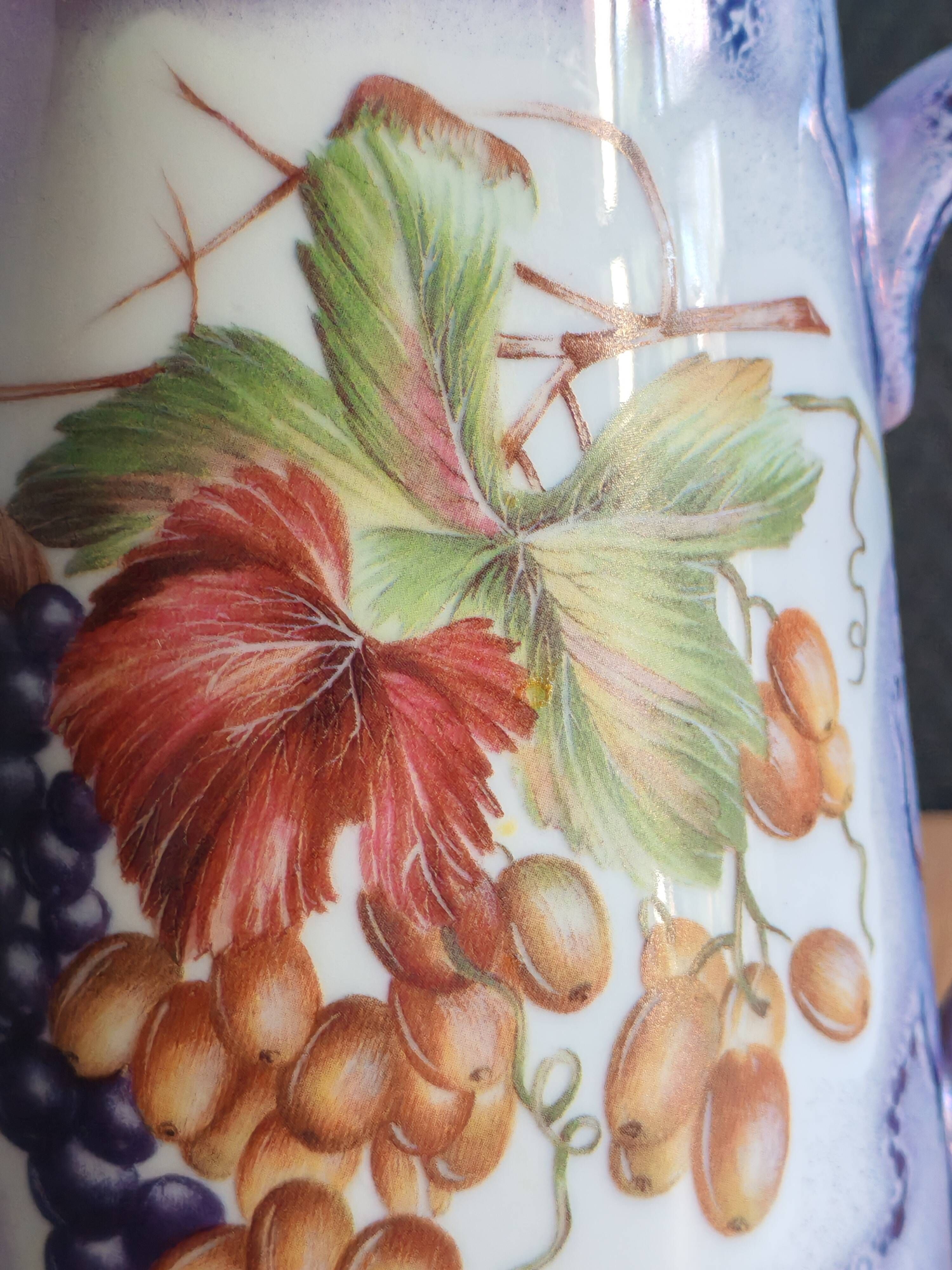 Vintage porcelain pitcher Lusseray France, decorated with grape clusters.