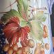 Vintage porcelain pitcher Lusseray France, decorated with grape clusters.