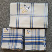 Cotton tablecloth for 12 place settings with napkins.
