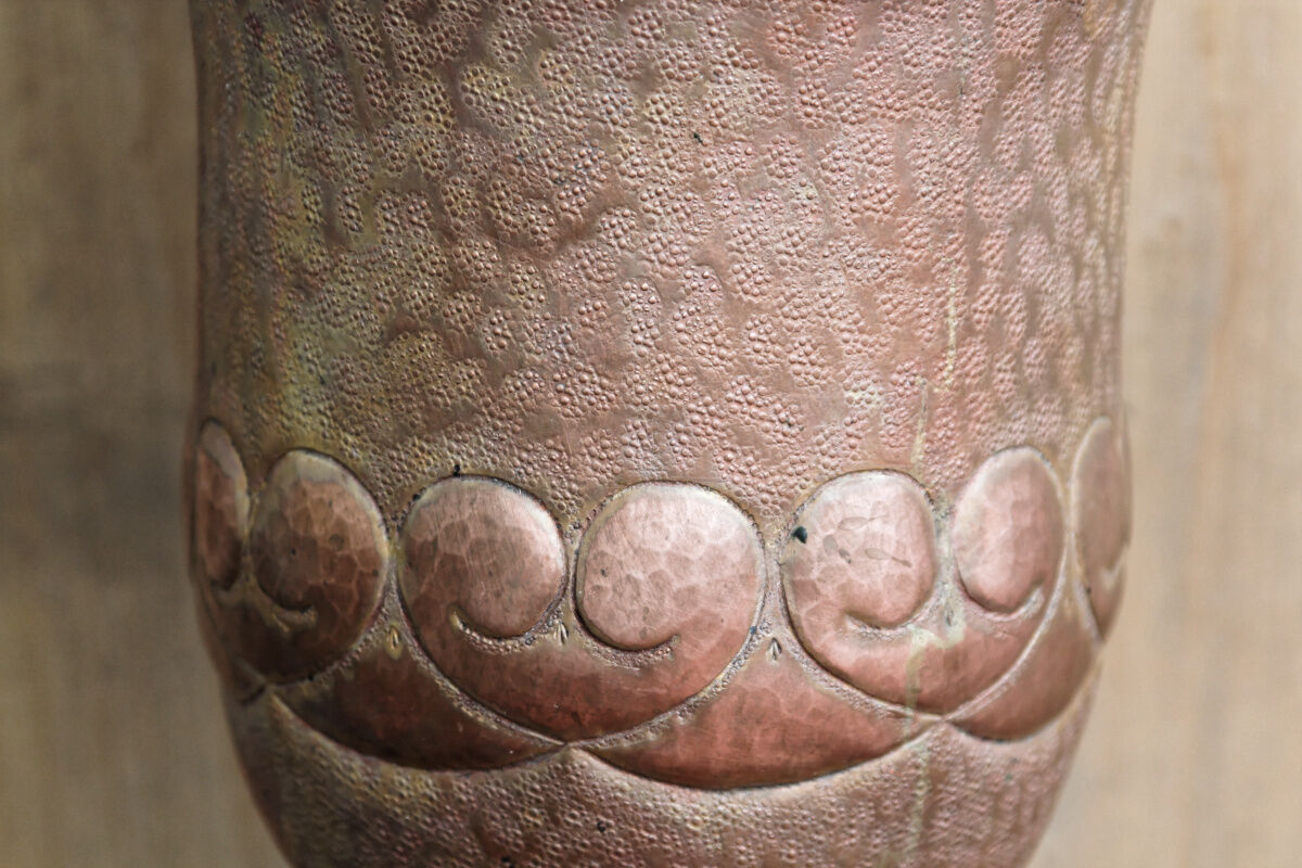 Copper vase hammered on pedestal