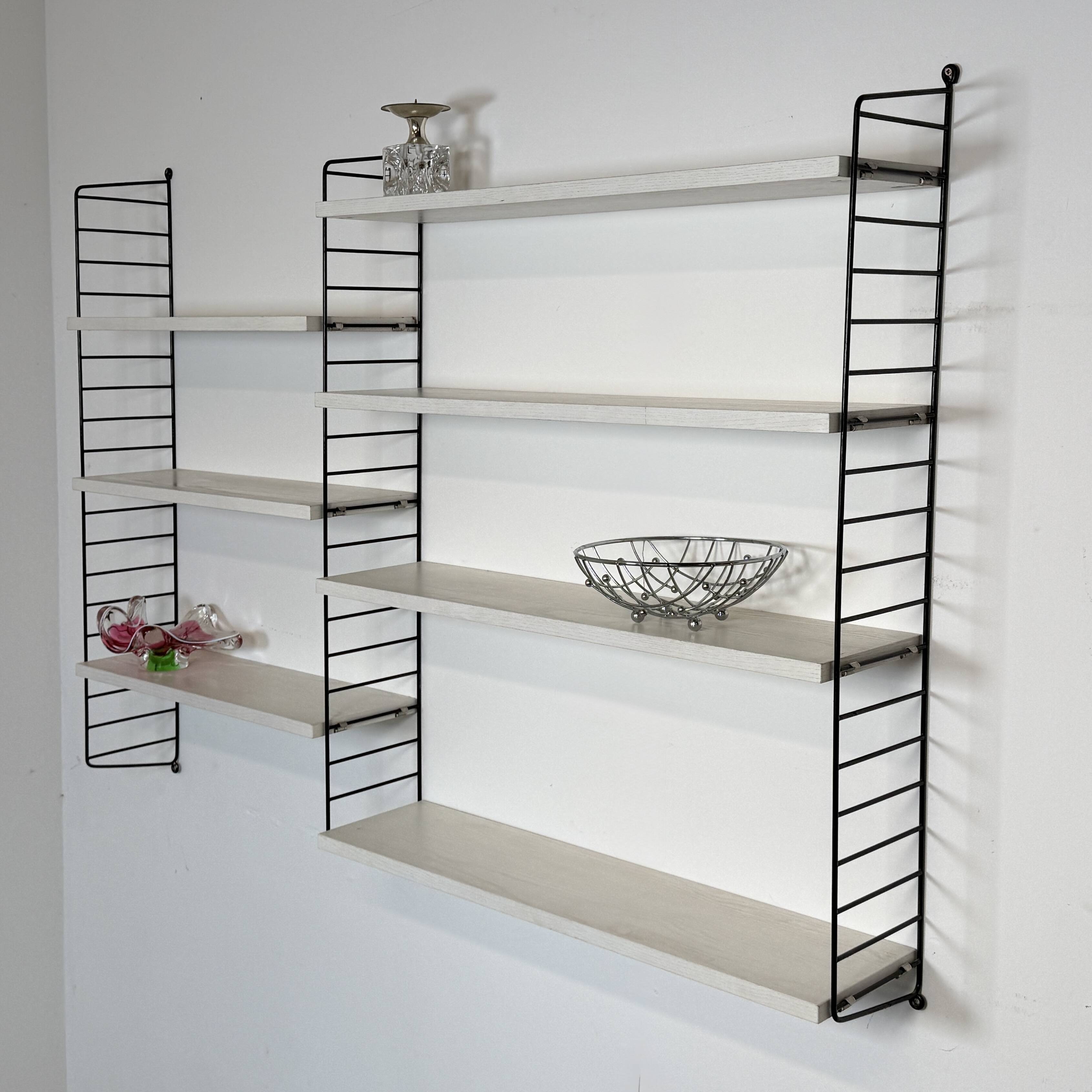 Vintage Nisse Strinning wall rack with 7 white shelves