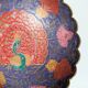 Vintage brass bowl with peacock motif, painted enamel, scalloped edge on a pedestal.