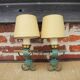 2 old wall lights in brass and painted wrought iron