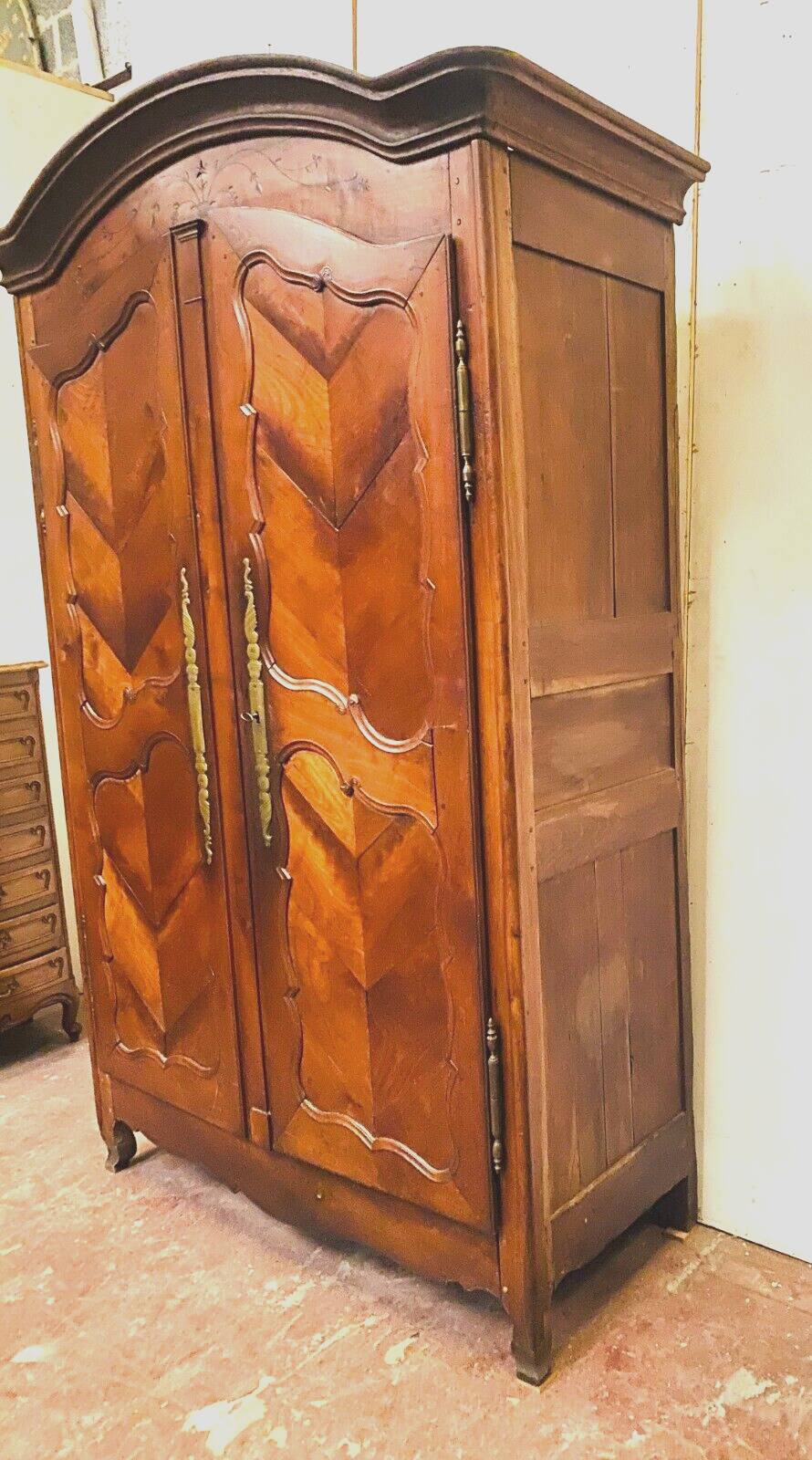 Louis XV armoire with gendarme's hat in solid cherry wood, 18th century