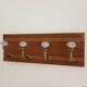 Wall-mounted coat rack with 4 ceramic hooks in blue and white, vintage style.
