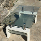 Coffee table in tempered glass and white metal.